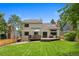 Home's backyard boasts a spacious deck and lush green lawn, ideal for outdoor entertaining at 23 Honey Locust, Littleton, CO 80127
