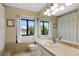 Well-lit bathroom with a tiled vanity, large mirror, and window views, offering a refreshing atmosphere at 23 Honey Locust, Littleton, CO 80127