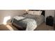 Comfortable bedroom with a queen-sized bed and natural light at 2625 S Xanadu Way # E, Aurora, CO 80014