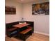 Eat-in kitchen area with breakfast nook, table, bench seating, and decorative wall art at 2625 S Xanadu Way # E, Aurora, CO 80014