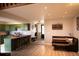 Modern eat-in kitchen featuring wood floors, breakfast bar, and bright, airy space at 2625 S Xanadu Way # E, Aurora, CO 80014