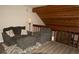 Cozy living room featuring an area rug and comfy furniture with wooden beam accents at 2625 S Xanadu Way # E, Aurora, CO 80014