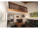 Bright and airy living room with wood accents, open floor plan, and ample seating at 2625 S Xanadu Way # E, Aurora, CO 80014