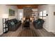 Cozy living room with a stone fireplace and natural light at 2625 S Xanadu Way # E, Aurora, CO 80014