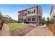The backyard offers a patio and a nice, grassy area to enjoy the outdoors at 23593 E Chenango Pl, Aurora, CO 80016