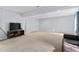Large finished basement featuring plush carpet and a media center at 23593 E Chenango Pl, Aurora, CO 80016