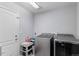 Bright laundry room with side by side washer and dryer at 23593 E Chenango Pl, Aurora, CO 80016