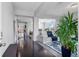 Bright, open-concept living space with hardwood floors and modern decor, perfect for entertaining at 23593 E Chenango Pl, Aurora, CO 80016