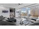 Bright living room with a large window, ceiling fan, and neutral colored walls at 23593 E Chenango Pl, Aurora, CO 80016