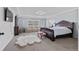 Spacious main bedroom with a sitting area, television, and lots of natural light at 23593 E Chenango Pl, Aurora, CO 80016