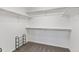 Walk-in closet with carpet floor and white walls featuring shelving and clothing racks at 23593 E Chenango Pl, Aurora, CO 80016
