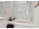 Bathroom with a tiled bathtub and shower combo with a large mirror and vanity at 1390 S Idalia St # 39F, Aurora, CO 80017