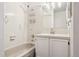 Bright bathroom featuring a shower-tub combo, vanity with sink, and chrome fixtures at 1390 S Idalia St # 39F, Aurora, CO 80017