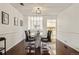 Dining room with modern table and chairs with view into the kitchen at 1390 S Idalia St # 39F, Aurora, CO 80017