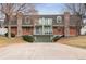 Multi-story townhouse with brick accents, balcony, and a convenient garage entry, perfect for modern living at 1390 S Idalia St # 39F, Aurora, CO 80017