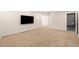 Unfinished basement space featuring neutral carpet, and ample space and ready for customization at 3465 Beeler Ct, Denver, CO 80238