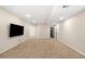 Finished basement with a large area, neutral carpet and ready for customization at 3465 Beeler Ct, Denver, CO 80238
