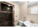 Bathroom featuring a tiled shower and vanity with modern fixtures at 3465 Beeler Ct, Denver, CO 80238