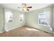 Bedroom with big windows and breezy white curtains at 3465 Beeler Ct, Denver, CO 80238