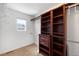 Walk-in closet featuring built-in shelves and hanging racks at 3465 Beeler Ct, Denver, CO 80238