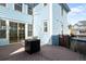 Back deck featuring a hot tub and mature tree with natural light at 3465 Beeler Ct, Denver, CO 80238