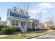 Beautiful two-story home featuring vibrant blue siding and a classic front porch at 3465 Beeler Ct, Denver, CO 80238