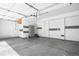 Spacious two-car garage with white walls and gray flooring at 3465 Beeler Ct, Denver, CO 80238
