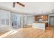 Bright and open living space featuring hardwood floors and a kitchen island at 3465 Beeler Ct, Denver, CO 80238