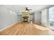 Spacious living room featuring a stone fireplace, hardwood floors, and ample natural light at 3465 Beeler Ct, Denver, CO 80238