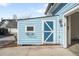 Exterior shot of the home's blue storage shed at 3465 Beeler Ct, Denver, CO 80238