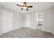 Bedroom with neutral walls, ceiling fan, and ensuite bathroom at 14441 E 102Nd Ave, Commerce City, CO 80022