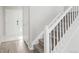 Welcoming entryway and staircase leading to the upper level with modern flooring and natural light at 14441 E 102Nd Ave, Commerce City, CO 80022