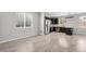 Spacious kitchen area with stainless steel appliances and ample natural light at 14441 E 102Nd Ave, Commerce City, CO 80022