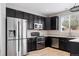 Spacious kitchen featuring stainless steel appliances and modern cabinetry at 14441 E 102Nd Ave, Commerce City, CO 80022
