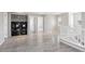 Upstairs laundry area with modern appliances, shelving and natural light from a window at 14441 E 102Nd Ave, Commerce City, CO 80022