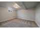 Empty finished basement space with carpet, one small window, and a single overhead light at 6026 Iris Way, Arvada, CO 80004