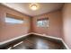 Cozy bedroom with hardwood floors, natural light, and neutral wall color at 6026 Iris Way, Arvada, CO 80004