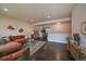 Spacious living room featuring comfortable seating, modern decor, and hardwood floors at 6026 Iris Way, Arvada, CO 80004