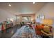 Comfortable living room with hardwood floors, stylish decor, and plenty of natural light at 6026 Iris Way, Arvada, CO 80004