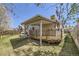 Exterior view of a covered back deck and landscaped backyard at 7075 Routt St, Arvada, CO 80004