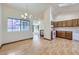 Bright dining room and kitchen area with hardwood floors and natural light at 7075 Routt St, Arvada, CO 80004