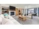 Bright living room with fireplace, built-in shelves, and ample seating area at 7075 Routt St, Arvada, CO 80004