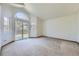 Spacious main bedroom with large sliding glass doors to the outdoor deck at 7075 Routt St, Arvada, CO 80004