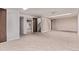 Finished basement boasts open space and multiple entry points for flexible usage at 6131 Wolff St, Arvada, CO 80003
