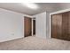 Finished basement with carpet flooring features storage and a neutral color palette at 6131 Wolff St, Arvada, CO 80003
