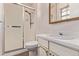 Functional bathroom with white vanity and a stand-up shower with sliding doors at 6131 Wolff St, Arvada, CO 80003