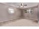 Neutral bedroom with carpeting and ample natural light from multiple windows at 6131 Wolff St, Arvada, CO 80003