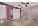 Cozy bedroom with a ceiling fan and attached bathroom with a stand-up shower at 6131 Wolff St, Arvada, CO 80003