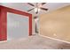 Cozy bedroom showcases a large closet for ample storage and plush carpeting at 6131 Wolff St, Arvada, CO 80003