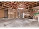 Spacious unfinished garage featuring a high ceiling and ample room for parking and storage at 6131 Wolff St, Arvada, CO 80003